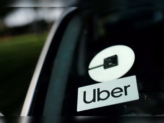 FILE PHOTO: An Uber logo is shown on a rideshare vehicle