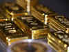 Gold holds near 7-week low on robust dollar, Fed taper fears