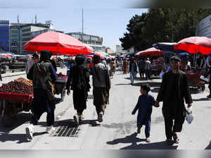 Taliban soldiers walk on a street in Kabul