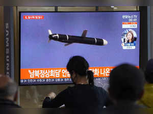Seoul: People watch a TV showing a file image of North Korea's missile launch du...