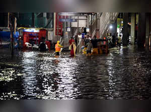 Hyderabad: Flooded street following heavy rains at Malakpet in Hyderabad, Friday...