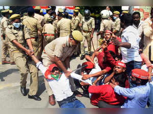 Prayagraj: Policemen detain Samajwadi Party  members as they staged a protest ov...