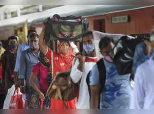 Mumbai: Travelers wait in a queue to get tested for COVID-19, at a railway stati...