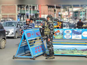 Srinagar: A security personnel stands guard at a check point, in Srinagar. Five ...