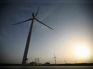 FILE PHOTO: Power generating windmill turbines are pictured during the inauguration ceremony of the new 25 MW ReNew Power wind farm at Kalasar village