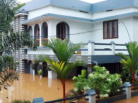 A house submerged in flood water