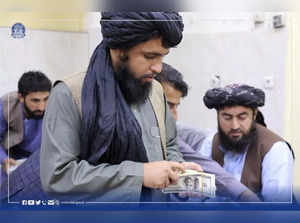 FILE PHOTO: Afghanistan's Taliban-controlled central bank seizes a large amount of money from former top government officials