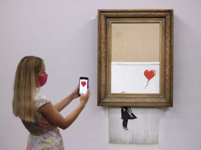 ​'Girl With Balloon' was originally stenciled on a wall in east London and has been endlessly reproduced, becoming one of Banksy’s best-known images.​