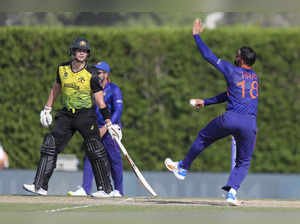 Dubai: India's captain Virat Kohli, right, bowls as Australia's Steven Smith wat...