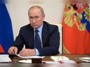 Russian President Vladimir Putin attends a meeting via a video link in Moscow