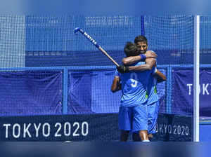 Tokyo: Indian players Gurjant Singh and Rupinder Pal celebrate their victory ove...