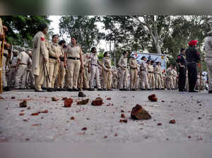 Patiala: Police stand guard following a clash with agitators during a protest by...