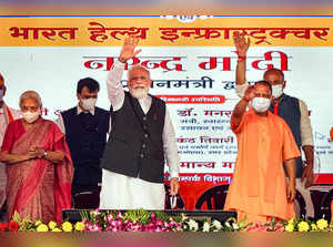 Varanasi: Prime Minister Narendra Modi and Chief Minister Yogi Adityanath at a p...