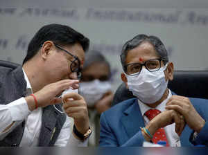 New Delhi: Chief Justice of India NV Ramana with Union Law Minister Kiren Rijiju...