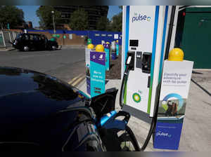 FILE PHOTO: An electric powered taxi is seen being charged at a BP Pulse electric vehicle charging point in London