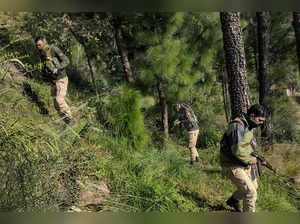 Poonch: Security personnel take position during an encounter with militants at N...