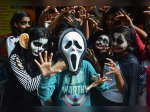 Thane: Art students with their faces painted, pose on the eve of Halloween, in T...