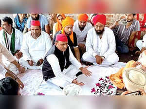 Samajwadi Party president Akhilesh Yadav meets the family of a farmer killed in Lakhimpur Kheri violence, on Friday.