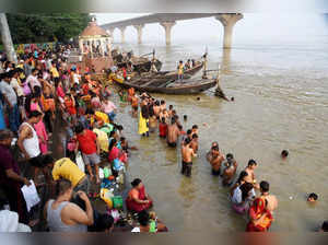 Patna: Devotees take a holy dip in the Ganga river on the first day of the 'Navr...