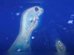 Coral surrounds two small islands on the Great Barrier Reef, located off the coast of Queensland, near the town of Rockhampton