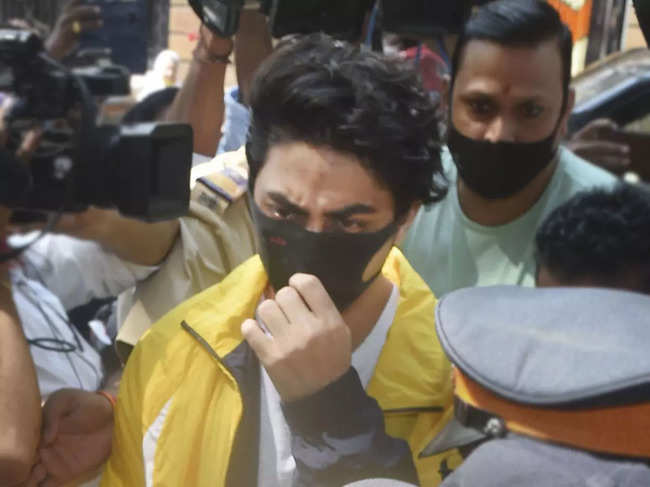 Dressed in a bright yellow jacket and crisp white T-shirt, Aryan Khan was accompanied by a bodyguard.