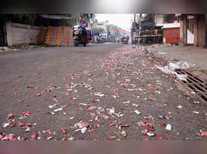 A street littered with rubbish from bursting of firecrackers