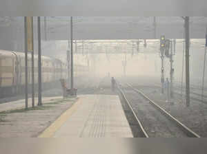 New Delhi: People cross a railway track at Shivaji Bridge Railway Station