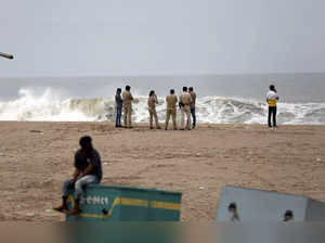 Veraval: Police personnel guard near the coastline ahead of the landfall of Cycl...