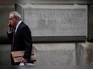 A man walks outside The Federal Reserve Bank of New York