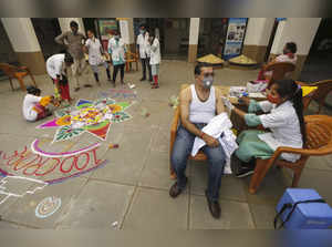 Ahmedabad: A beneficiary receives a dose of a COVID-19 vaccine at a health care ...