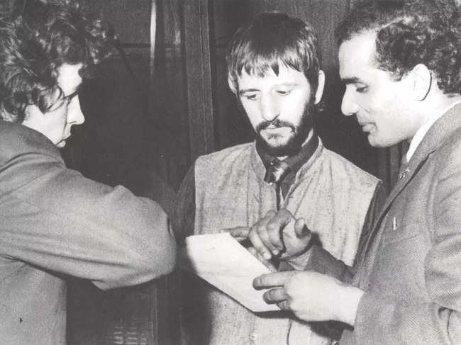 Suresh Joshi meets with engineer John Brahn and Ringo Starr in 1968 in Liverpool, in this undated handout obtained by Reuters on November 10, 2021.