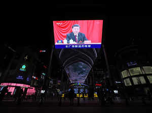 Giant screen shows Chinese President Xi Jinping attending the sixth plenary session of the 19th Central Committee of the Communist Party of China (CPC), in Beijing