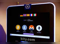 Logos and exchange rates of Bitcoin, Litecoin, Monero and Ether to Swiss franc are seen on a cryptocurrency ATM in Zurich