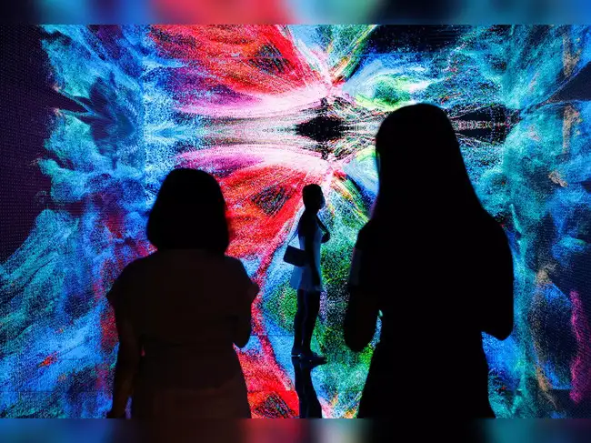 Visitors are pictured in front of an art installation which will be converted into NFT and auctioned online at Sotheby