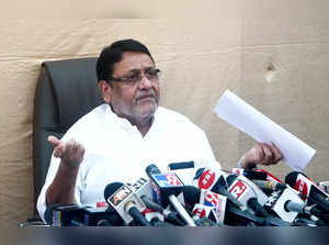 Mumbai: Maharashtra minister and NCP leader Nawab Malik reacts as he addresses a...