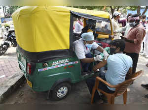 Ranchi: Health workers administer COVID-19 vaccine doses to auto-rickshaw driver...