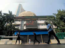 People walk past the Bombay Stock Exchange (BSE) building in Mumbai