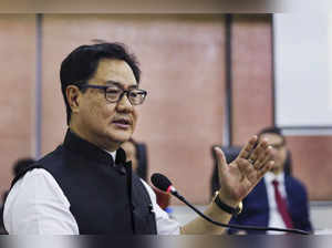 Ahmedabad: Union Law Minister Kiren Rijiju addresses during a program on legal a...