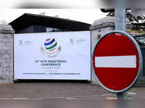 FILE PHOTO: A sign of the 12th Ministerial Conference (MC12) is pictured at the WTO headquarters in Geneva