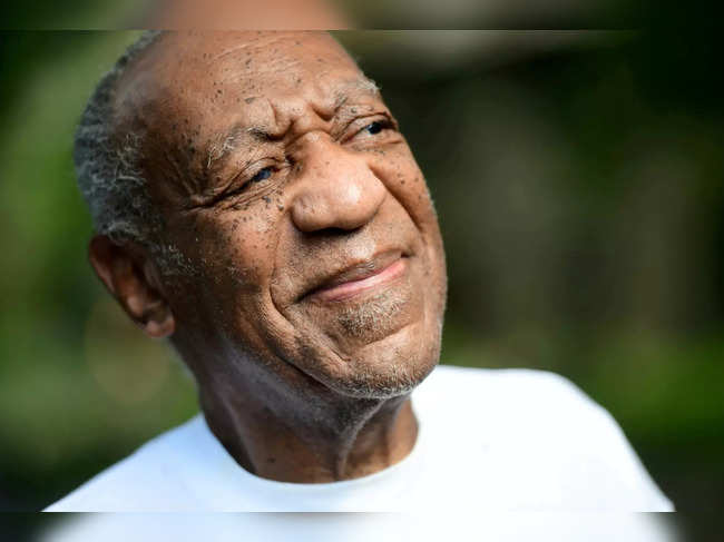 FILE PHOTO: Bill Cosby looks on outside his house after Pennsylvania's highest court overturned his sexual assault conviction and ordered him released from prison immediately, in Elkins Park