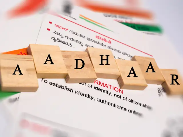 ​How many times can one's name be updated in Aadhaar card?