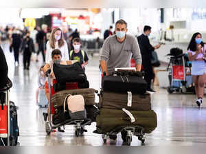Travellers arrive at the international terminal at Sydney Airport in Sydney