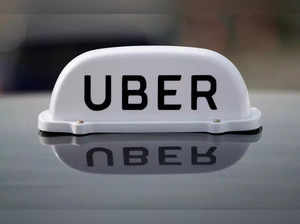 FILE PHOTO_ The Logo of taxi company Uber is seen on the roof of a private hire taxi in Liverpool.