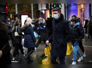 People walk through Oxford Street, amid the COVID-19 outbreak in London