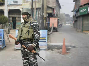 Srinagar: A security personnel stands guard during a strike called by the Hurriy...
