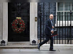 British Health Secretary Sajid Javid walks outside Downing Street in London