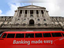 FILE PHOTO: A bus passes in front of the Bank of England, in London