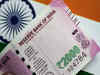 Rupee weakens slightly as Fed quickens taper but huge RBI reserves seen curbing volatility