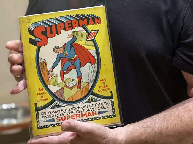 ?Mark Michaelson holds his rare copy of a Superman #1 comic book that sold on newsstands for a dime in 1939. ?