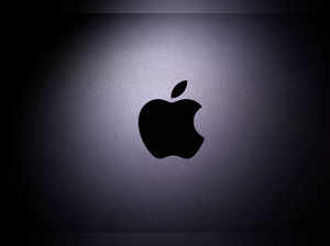Apple logo is seen on the Macbook in this illustration taken